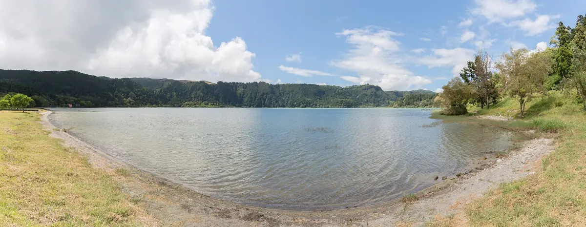 Furnas lake shore under a cloudy Atlantic sky