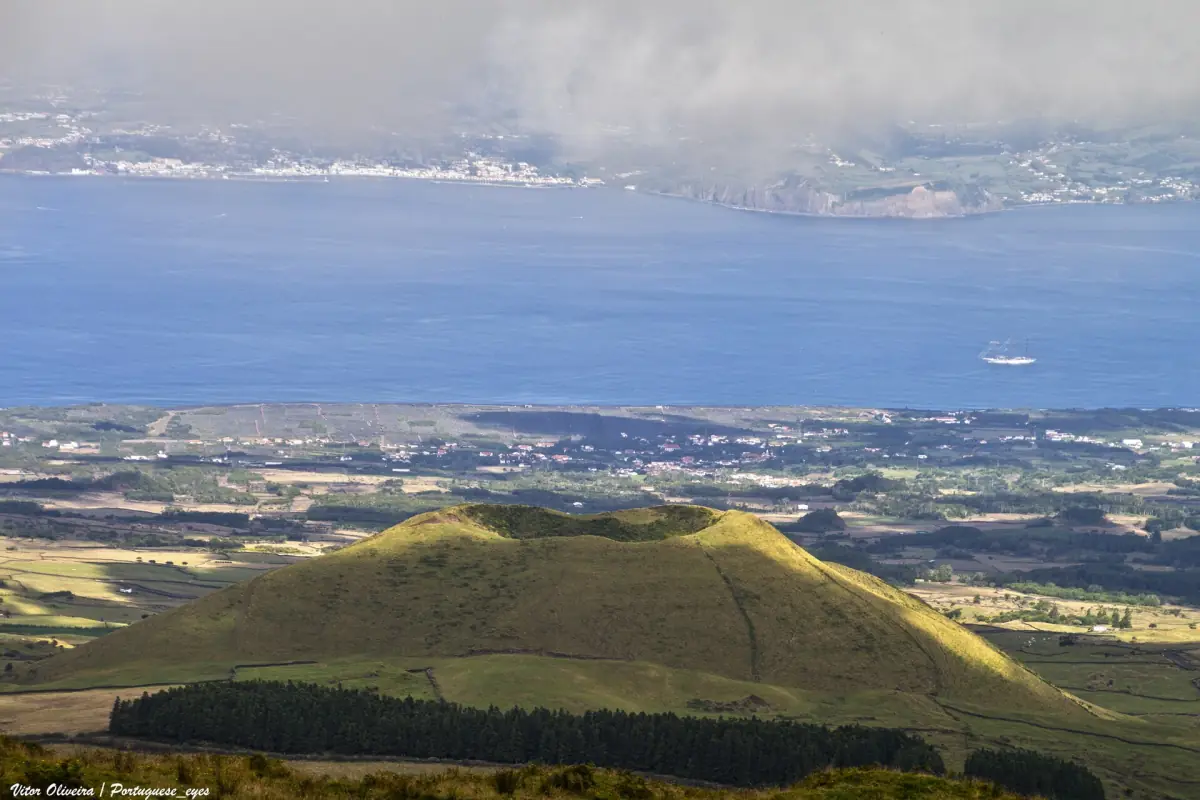 Green volcanic hill on Pico island in summer light