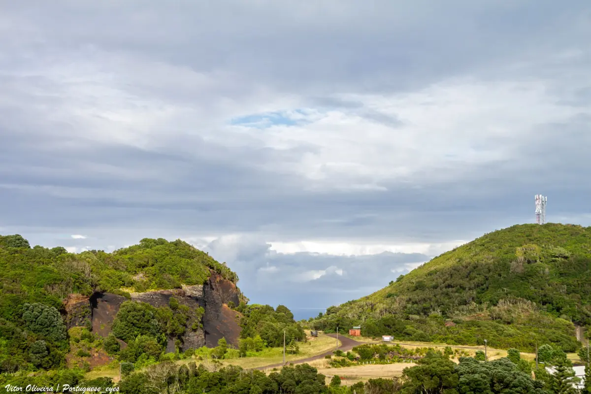 Green hills and pastures on Pico island under an open sky
