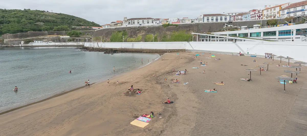 Sandy bathing area beside a promenade on Terceira island